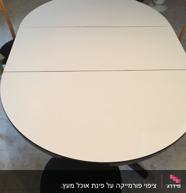 Oval table with wooden chairs around it